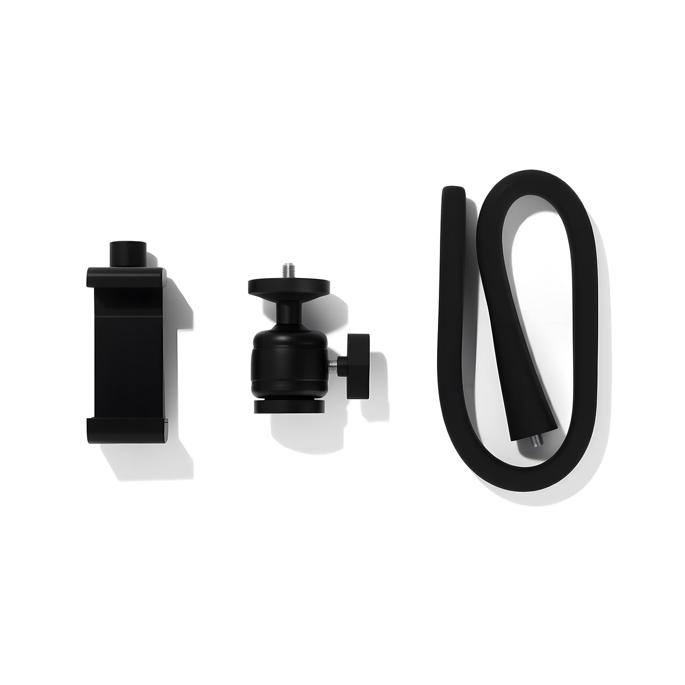Black camera accessories including a lens cap, tripod ball head, and cable on a white background